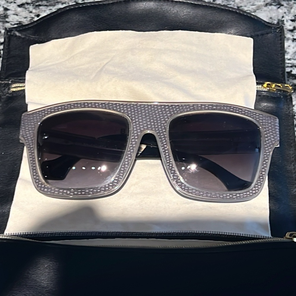 Balenciaga exotic lizard, sunglasses/gray with case that doubles as a clutch.